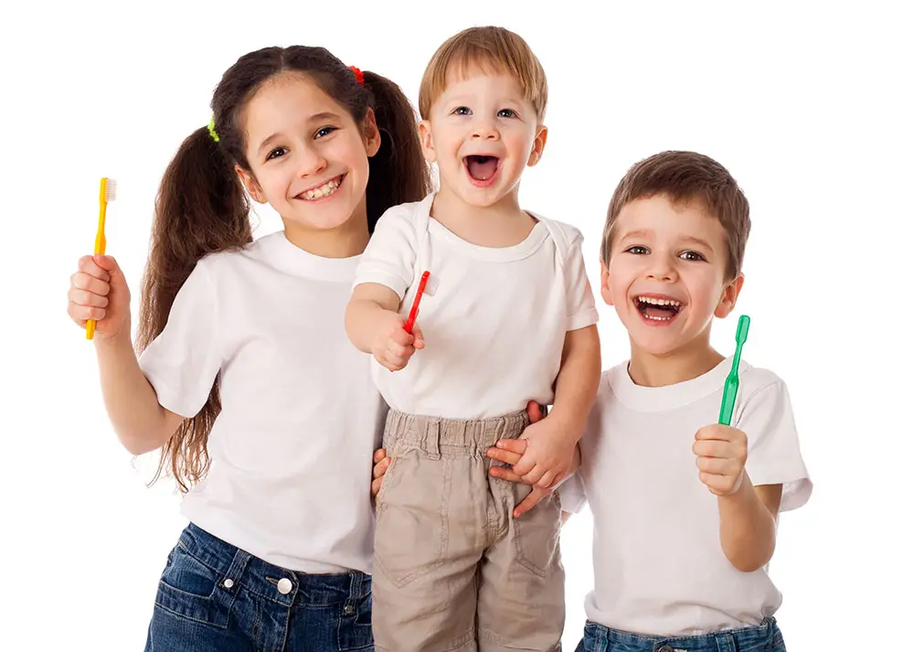happy kids with toothbrushes
