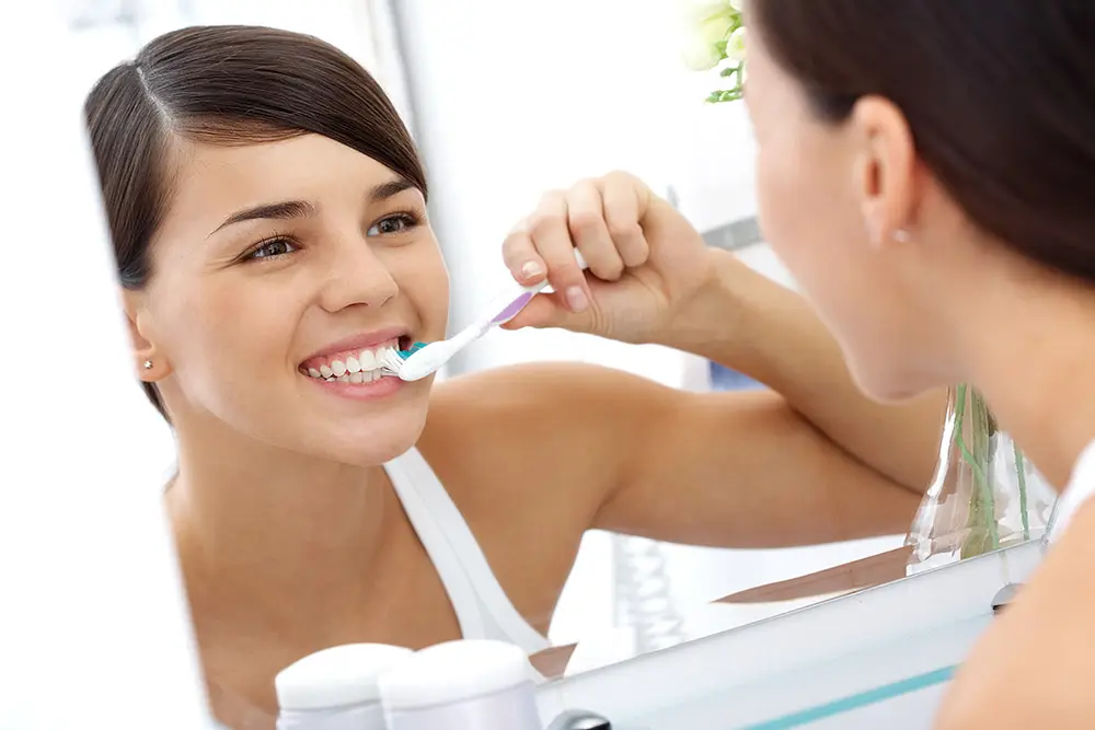 Girl brushing her teeth